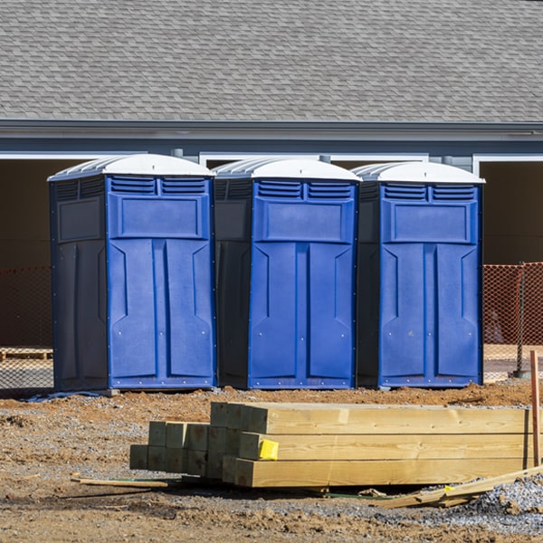what is the cost difference between standard and deluxe portable restroom rentals in Torrington WY